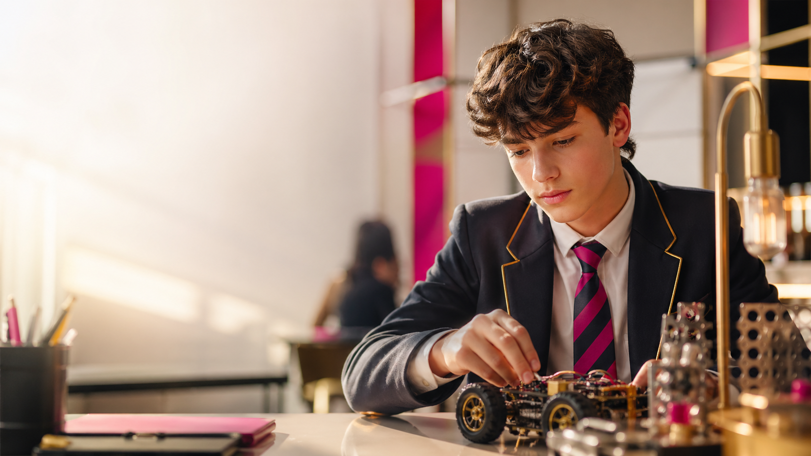 Young student building an engineering project in a STEM lab